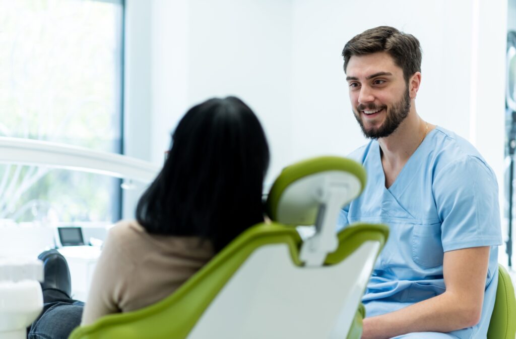 A dentist discusses a patient's options for tonsil stone removal with them.