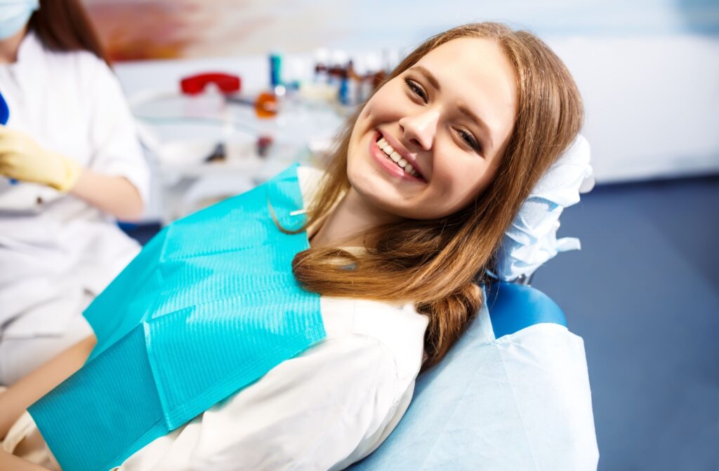 A smiling young patient, ready for their dentist appointment and unworried about the treatment thanks to Solea laser dentistry.